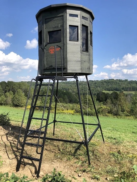360 Pro hunting blind in green color on a metal stand with ladder, side view