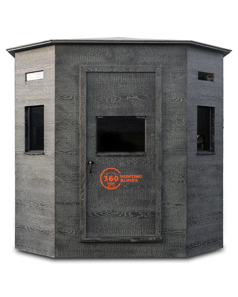 Front view of the Shootin' House XL hunting blind in dark gray color with a door and windows.