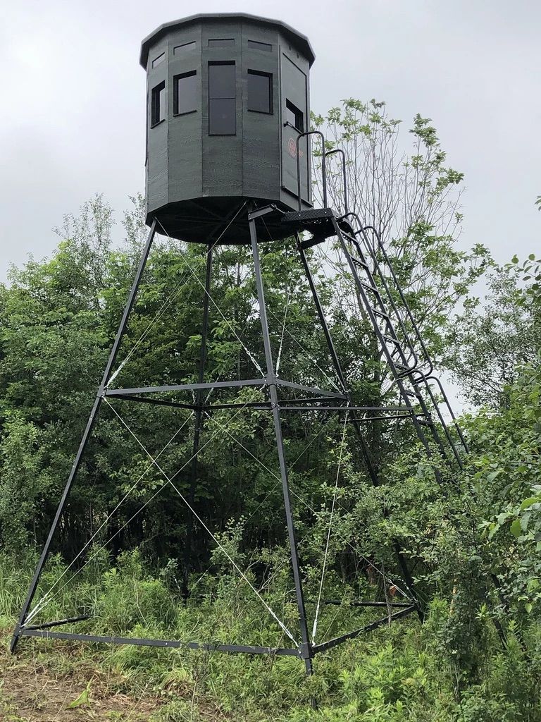 360 Pro XL hunting blind in dark green color on a metal frame, elevated with ladder access.